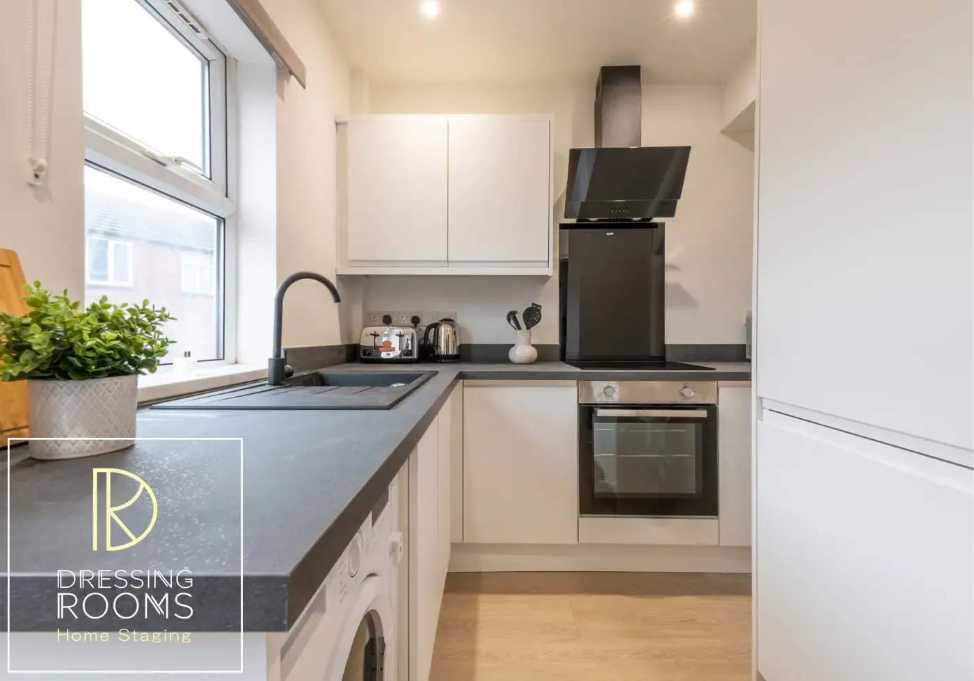 Compact fitted kitchen prepared for short-term rental guests