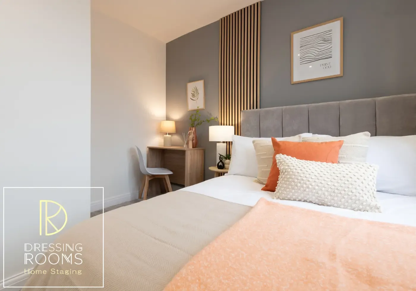 Guest bed styled with peach throw and patterned cushions
