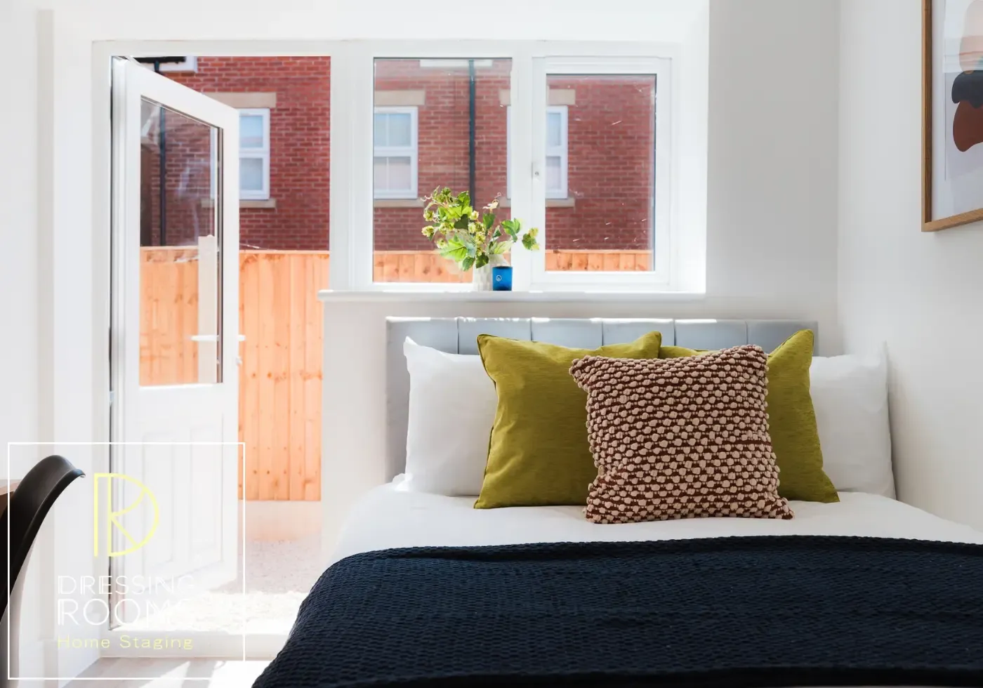 Compact shared house bedroom styled in navy and rust