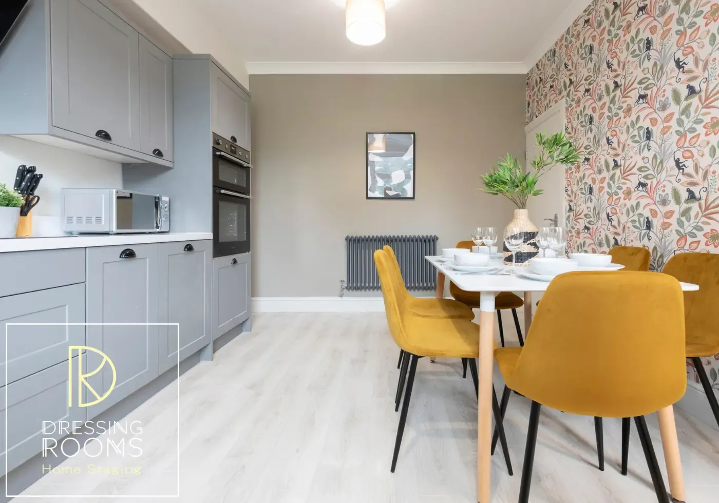 Shared kitchen dining space with grey cabinetry