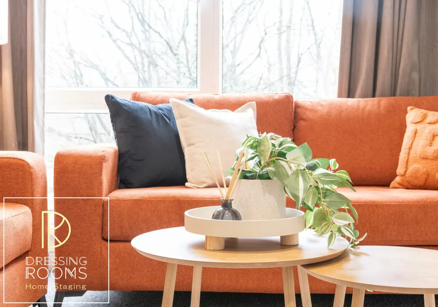 Rust sofa and coffee table styled for guest stays