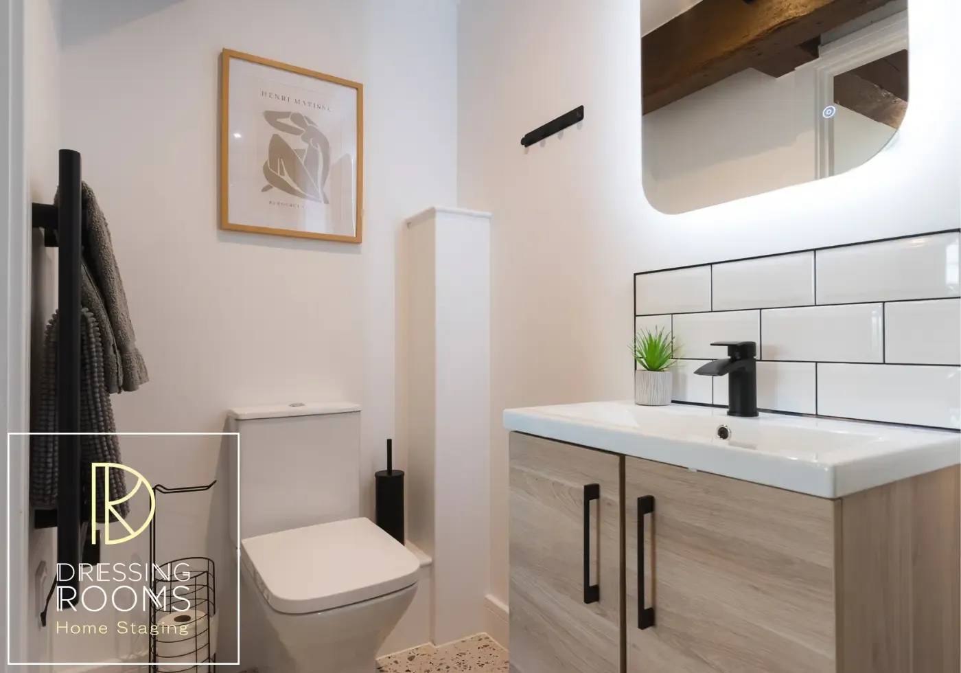 Compact shower room with black fittings and white tiles