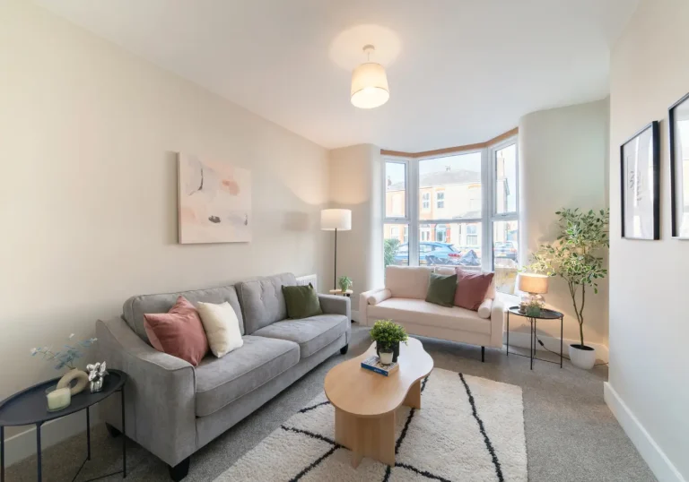 After home staging lounge with grey sofas and wood accents