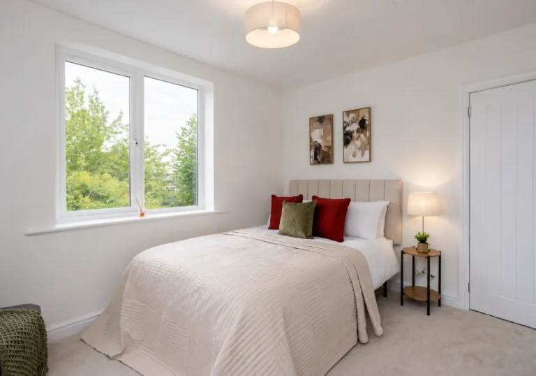 After professional home staging bedroom with cream bedspread