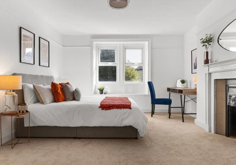 After staging bedroom coral throw and cushions