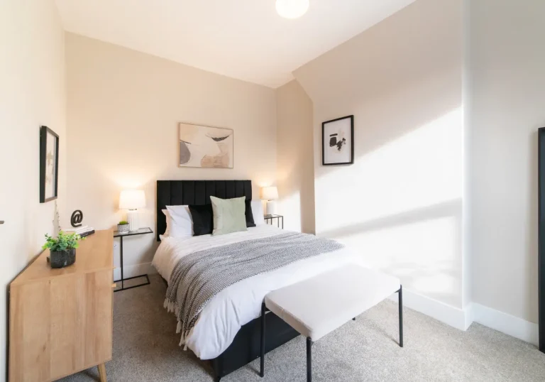 After staging bedroom with black bed