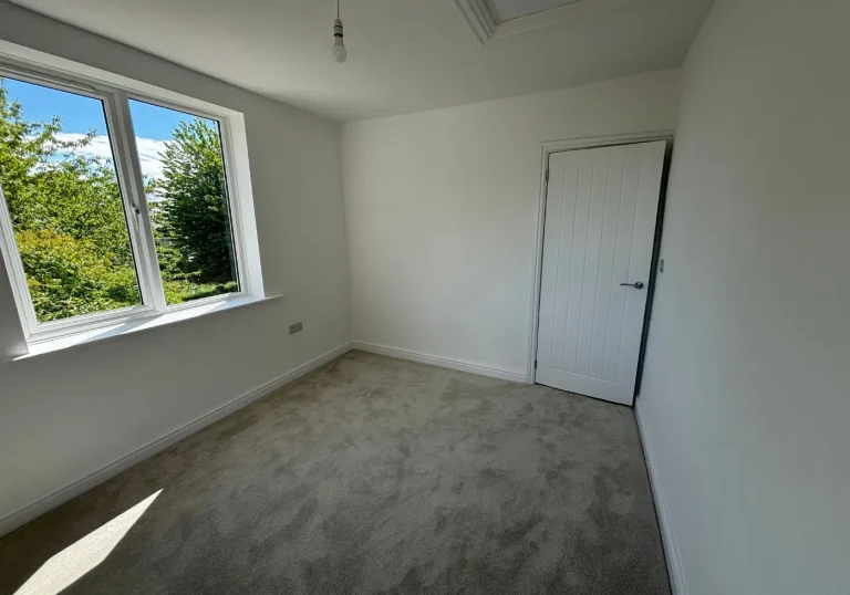 Before home staging bedroom with beige carpets