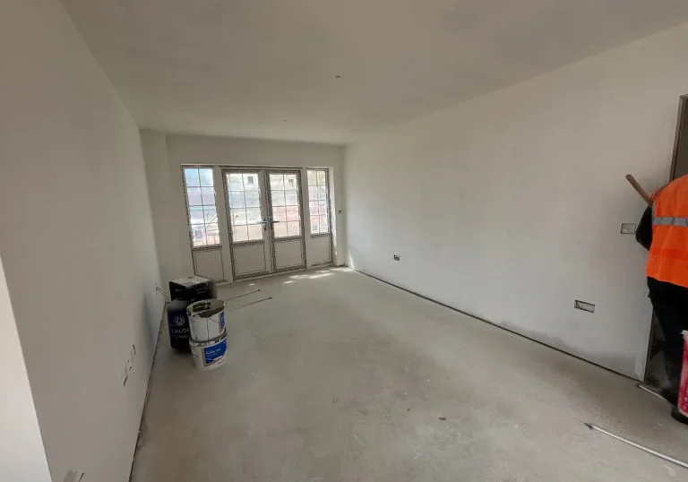 Before home staging lounge with all white walls