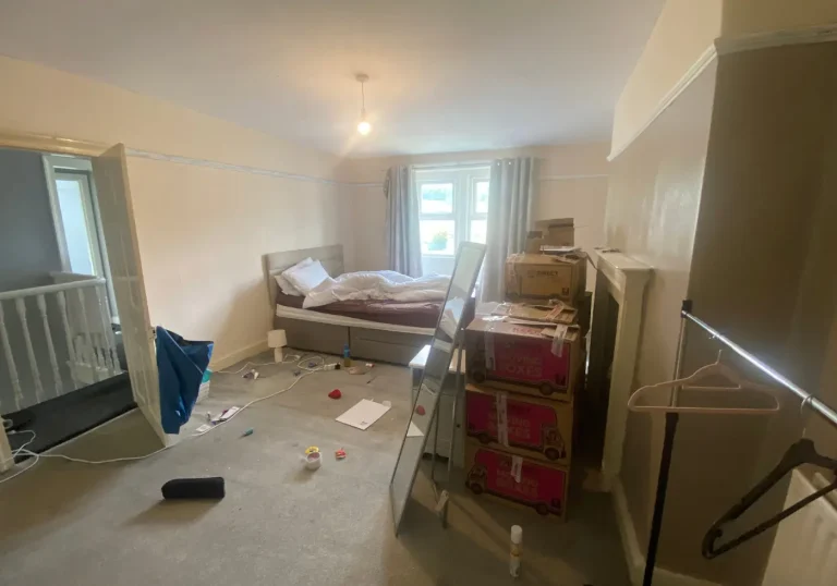 Before professional home staging cluttered bedroom