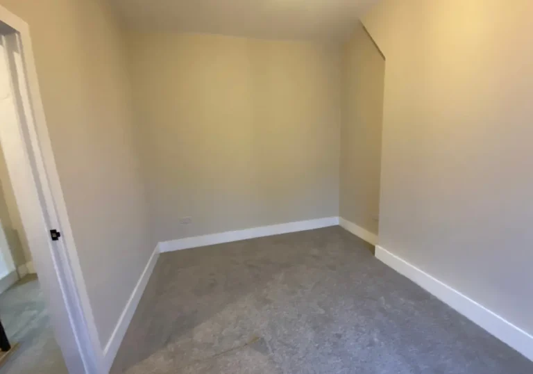 Before staging bedroom with white walls